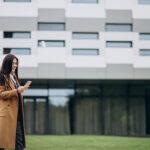 Mortgage in Default: A Lender’s Guide to Mortgage Enforcement in Ontario  Young business woman using phone
